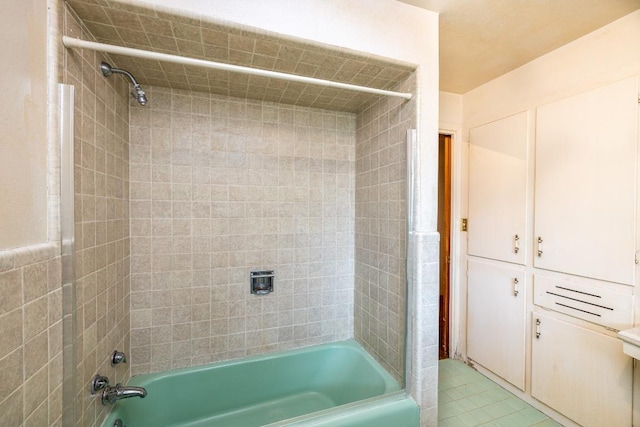 full bath featuring shower / washtub combination and tile patterned flooring