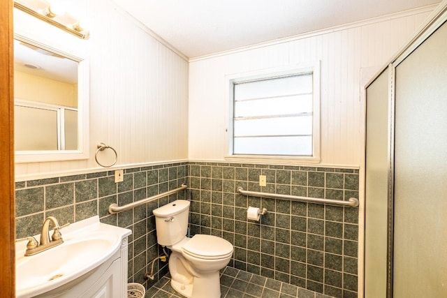 full bath with toilet, a shower with shower door, tile patterned floors, and vanity