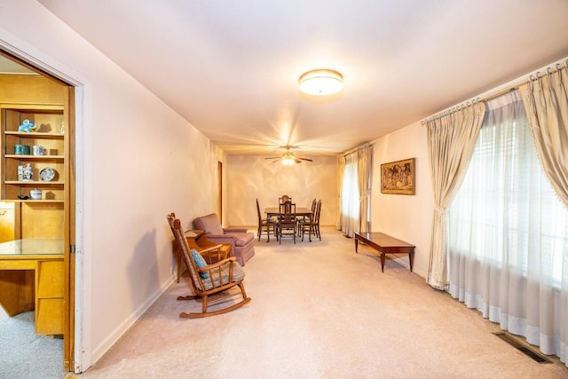 sitting room featuring carpet, visible vents, and baseboards