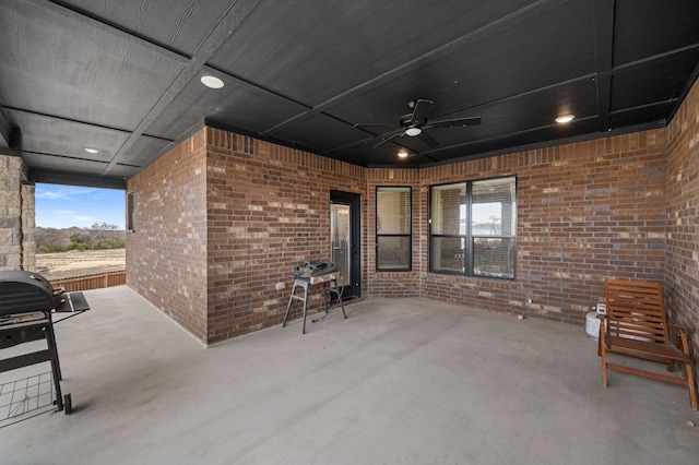 view of patio / terrace with ceiling fan and area for grilling