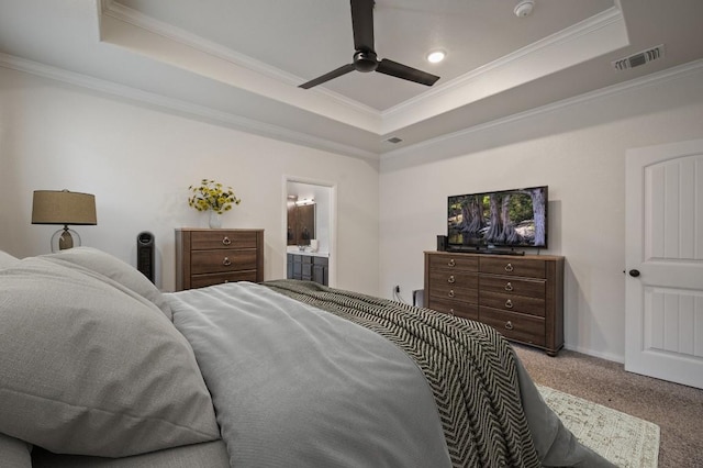 bedroom with visible vents, a raised ceiling, carpet flooring, and ornamental molding