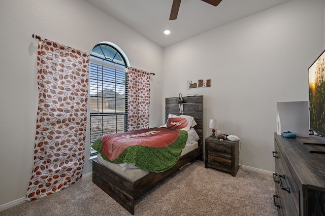 bedroom featuring recessed lighting, light colored carpet, ceiling fan, and baseboards