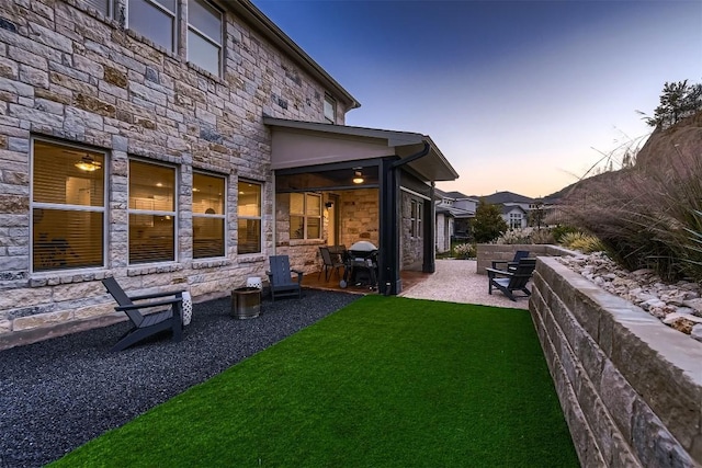 219 Baldovino Skwy, Lakeway, TX 78738 - yard at dusk with a patio area and a yard