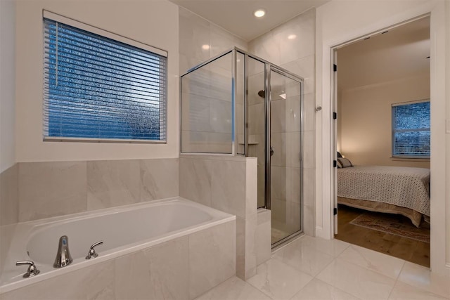 219 Baldovino Skwy, Lakeway, TX 78738 - ensuite bathroom with a stall shower, a garden tub, recessed lighting, and marble finish floors