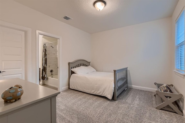 219 Baldovino Skwy, Lakeway, TX 78738 - bedroom featuring light colored carpet and a textured ceiling