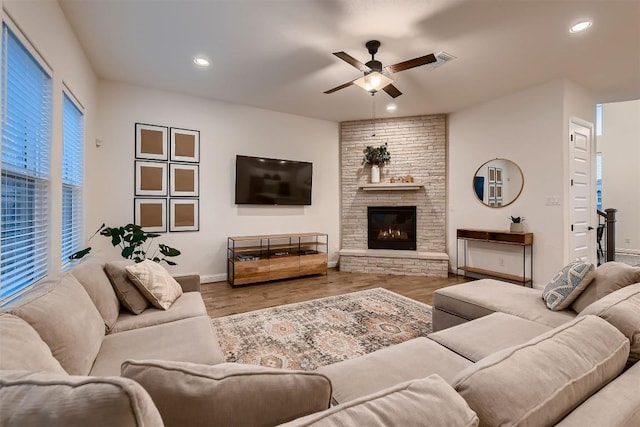 219 Baldovino Skwy, Lakeway, TX 78738 - living room with ceiling fan, wood finished floors, recessed lighting, and a fireplace