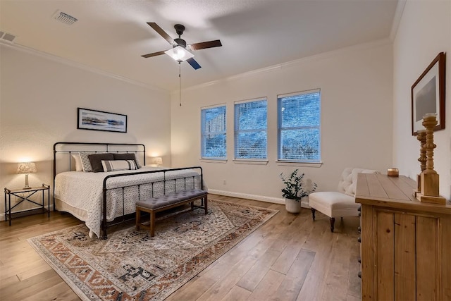 219 Baldovino Skwy, Lakeway, TX 78738 - bedroom featuring wood finished floors, crown molding, and ceiling fan