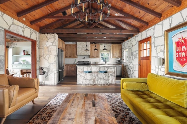 19745 Lakehurst Loop, Spicewood, TX 78669 - living area with a chandelier, dark wood-style floors, and wood ceiling