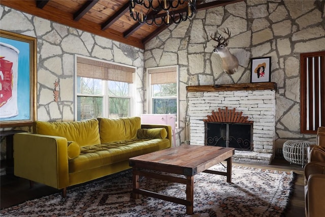 19745 Lakehurst Loop, Spicewood, TX 78669 - living area featuring wood ceiling, a large fireplace, and a chandelier