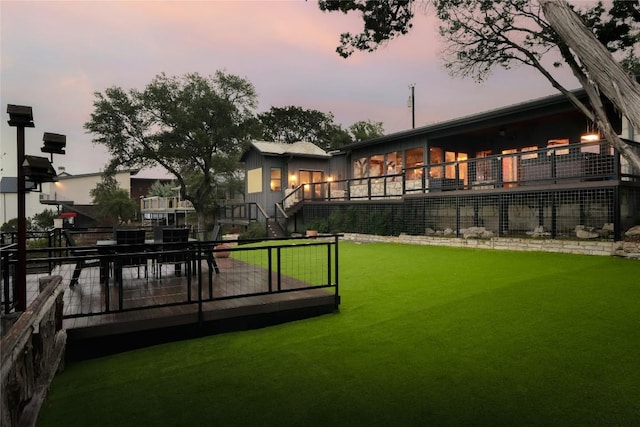 19745 Lakehurst Loop, Spicewood, TX 78669 - back of property with a yard, a wooden deck, and stairs