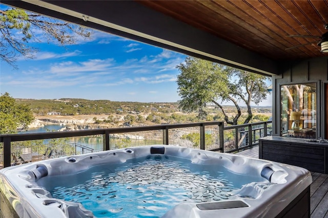19745 Lakehurst Loop, Spicewood, TX 78669 - wooden terrace featuring a hot tub and a water view