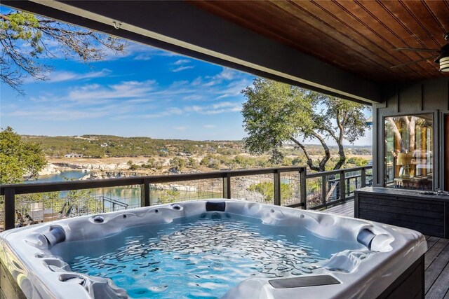 19745 Lakehurst Loop, Spicewood, TX 78669 - deck with a hot tub and a water view