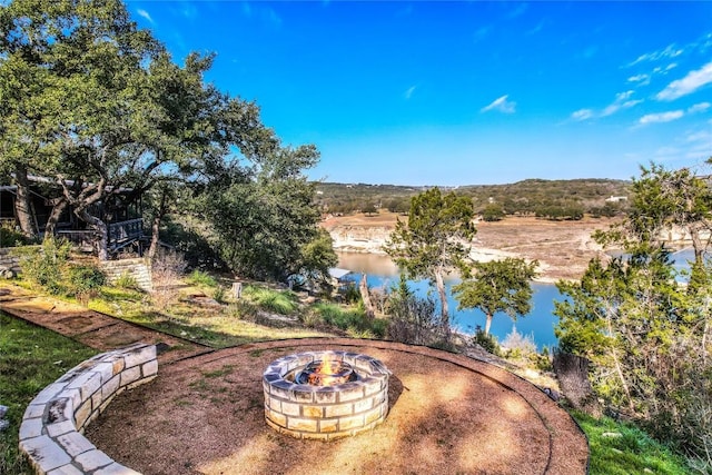 19745 Lakehurst Loop, Spicewood, TX 78669 - view of patio / terrace with a fire pit and a water view