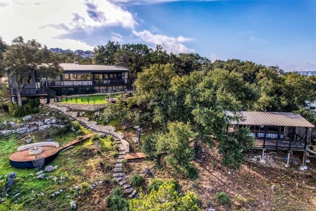 19745 Lakehurst Loop, Spicewood, TX 78669 - rear view of property featuring stairs and a metal roof