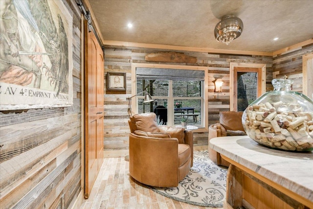 1920 River Rd, Wimberley, TX 78676 - sitting room featuring wood walls, recessed lighting, and ornamental molding