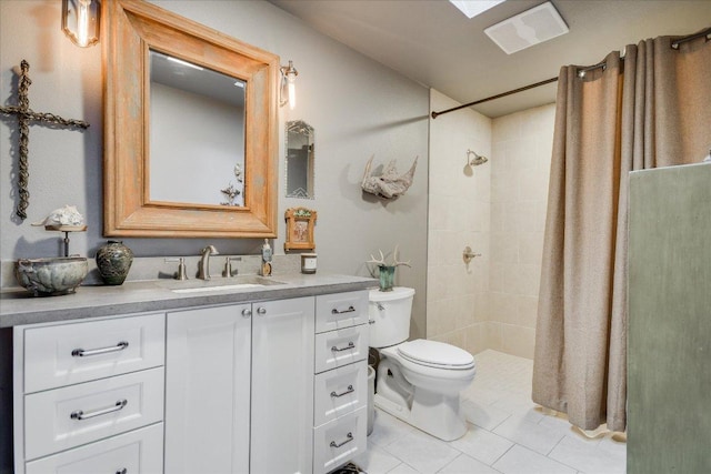 1920 River Rd, Wimberley, TX 78676 - bathroom with toilet, vanity, tiled shower, and tile patterned flooring