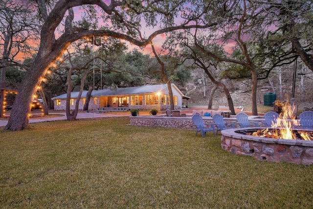 1920 River Rd, Wimberley, TX 78676 - view of grassy yard featuring an outdoor fire pit