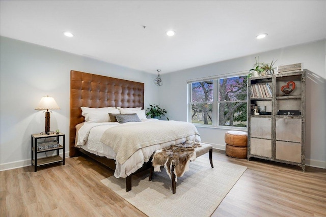 1920 River Rd, Wimberley, TX 78676 - bedroom with wood finished floors, recessed lighting, and baseboards