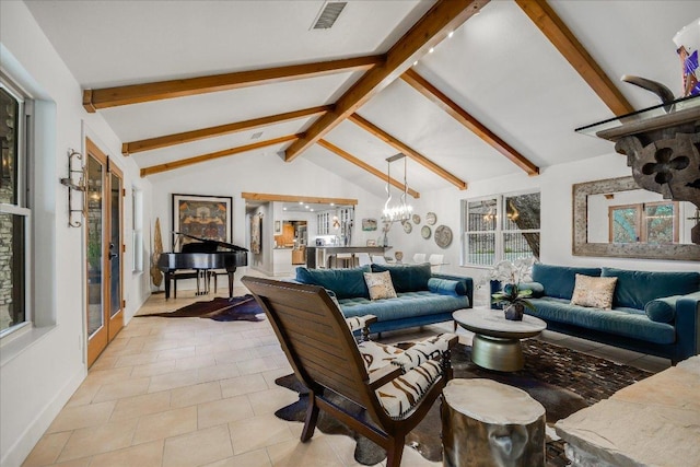 1920 River Rd, Wimberley, TX 78676 - living room featuring light tile patterned flooring and a chandelier