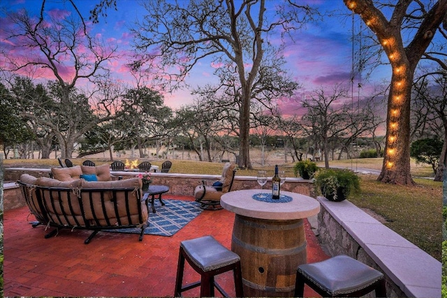 1920 River Rd, Wimberley, TX 78676 - patio terrace at dusk featuring a patio