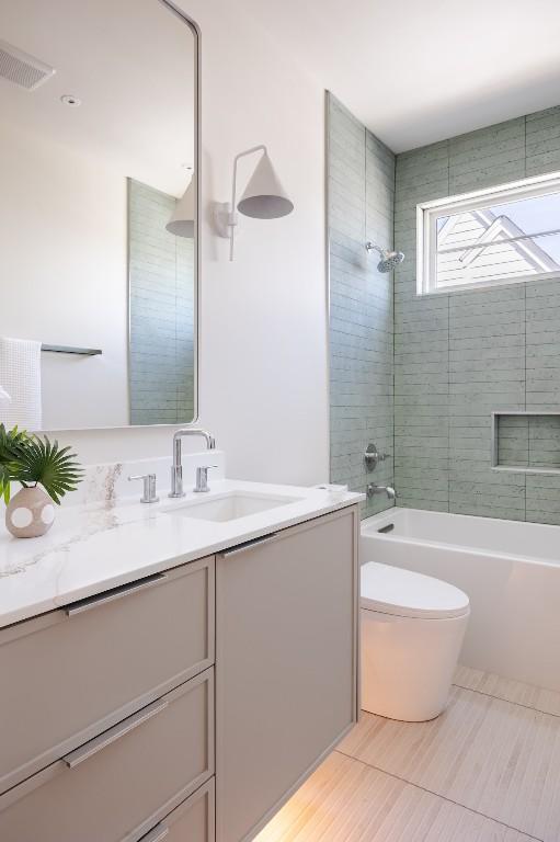 full bathroom with toilet, washtub / shower combination, visible vents, and vanity