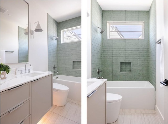 full bathroom featuring toilet, shower / bath combination, tile patterned flooring, and vanity