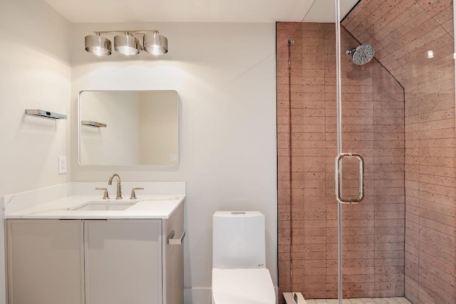 bathroom featuring a shower stall, toilet, and vanity