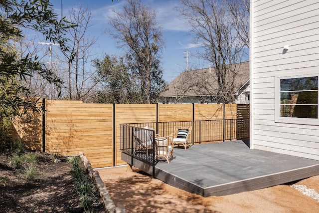 view of patio / terrace with a fenced backyard and a wooden deck