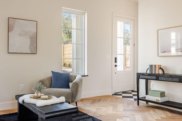 foyer featuring baseboards