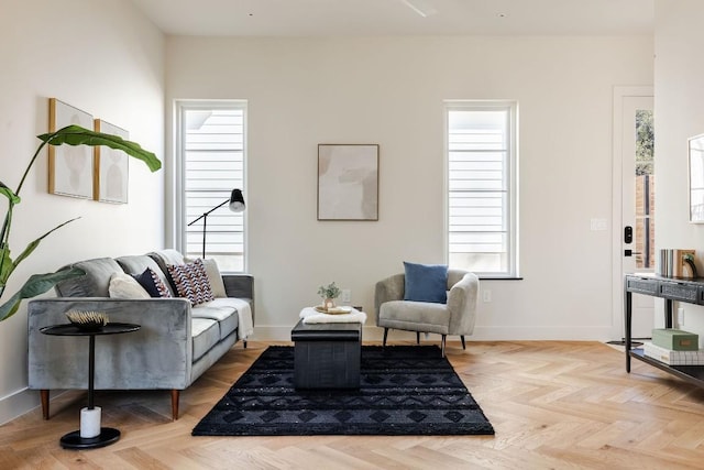 living room with baseboards and a wealth of natural light