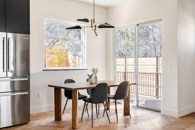 dining area featuring baseboards