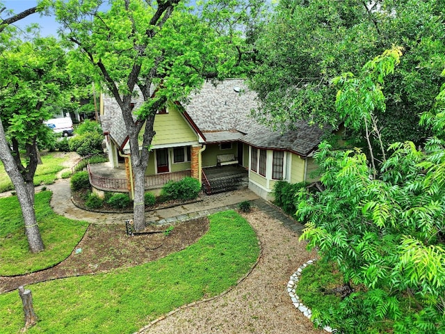 view of front of house with a shingled roof