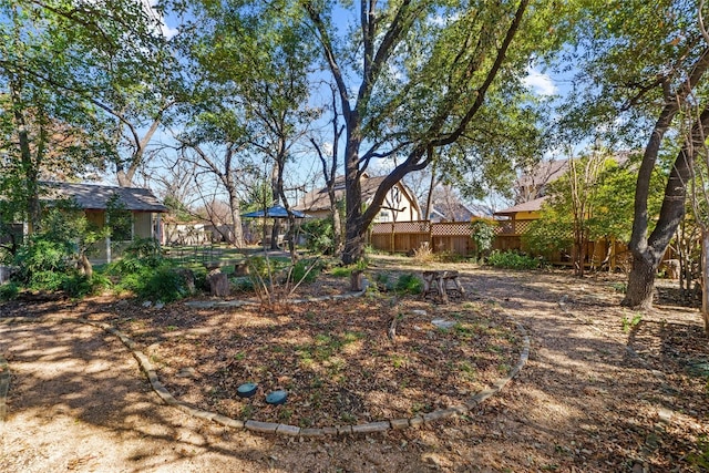 view of yard featuring a fenced backyard and a gazebo