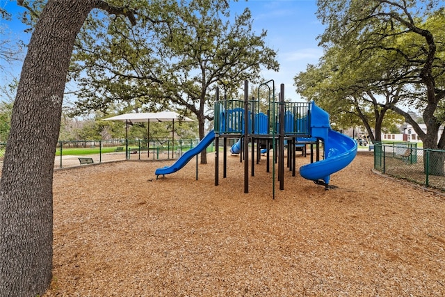 communal playground featuring fence