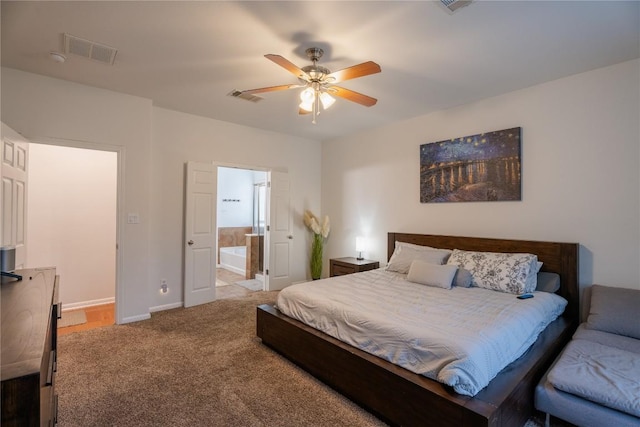 carpeted bedroom featuring visible vents, connected bathroom, baseboards, and ceiling fan