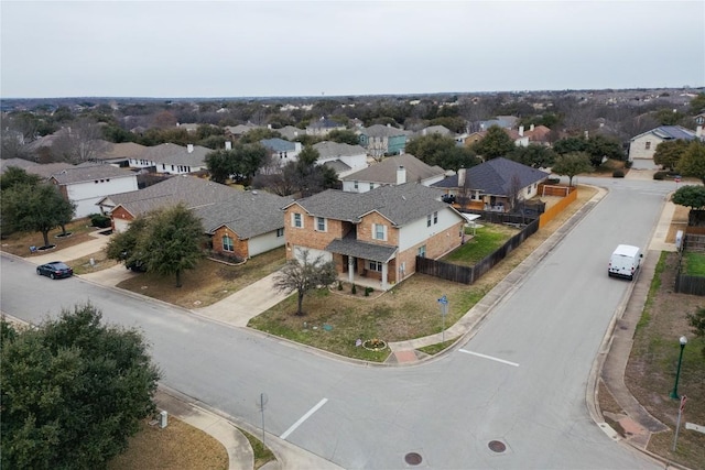 birds eye view of property with a residential view