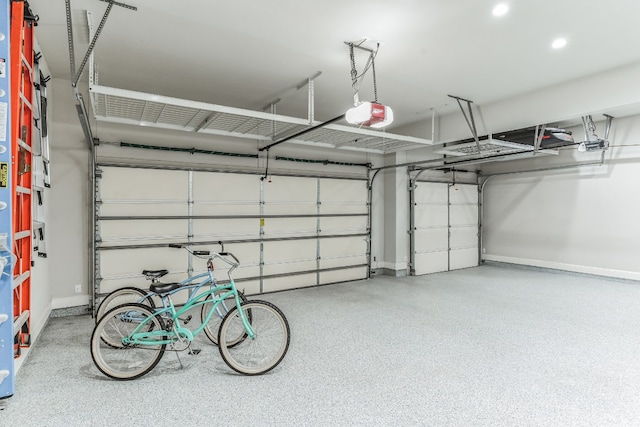 garage featuring baseboards and a garage door opener