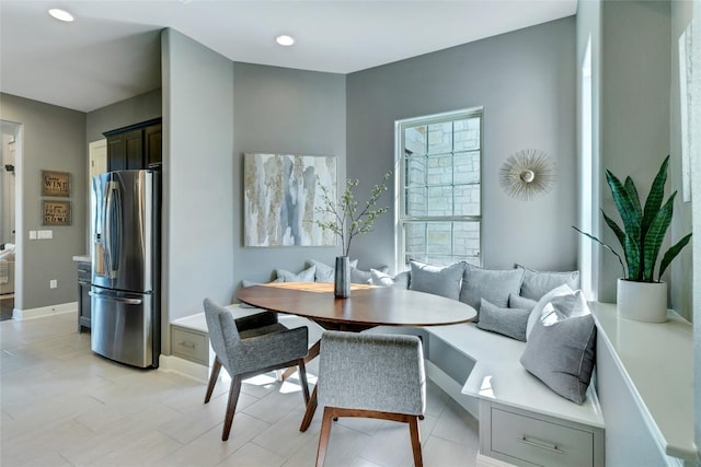 dining room with baseboards and breakfast area