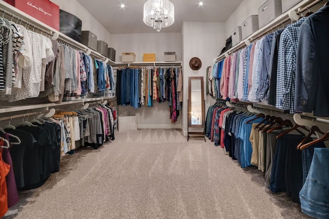 spacious closet featuring carpet floors and a notable chandelier