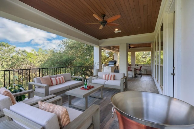 view of patio / terrace with ceiling fan, outdoor lounge area, exterior kitchen, and grilling area