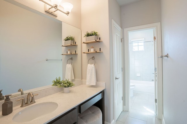 bathroom with bathtub / shower combination, vanity, toilet, and tile patterned floors