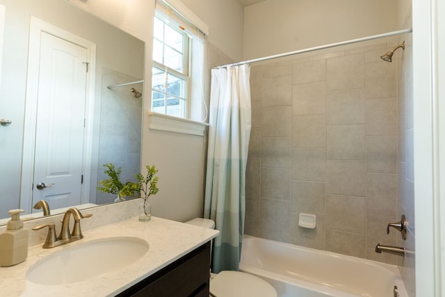 full bath with shower / bath combination with curtain, vanity, and toilet