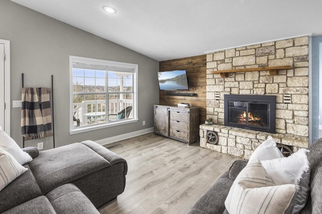 911 Sandy Mountain Dr, Sunrise Beach, TX 78643 - living area featuring vaulted ceiling, a fireplace, wood finished floors, recessed lighting, and baseboards