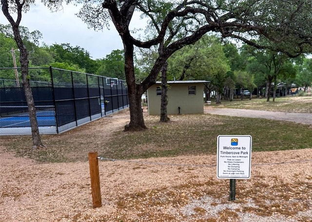 911 Sandy Mountain Dr, Sunrise Beach, TX 78643 - view of property's community with fence and a tennis court