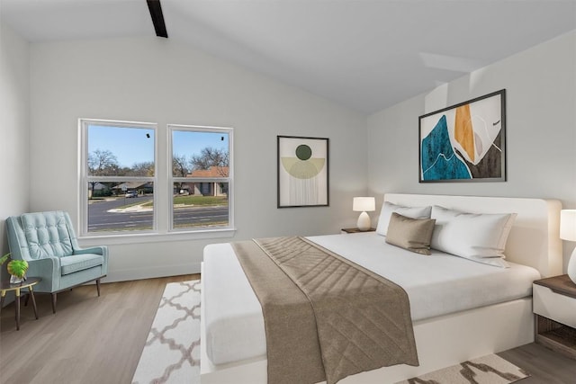 10505 Parkfield Dr, Austin, TX 78758 - bedroom with lofted ceiling with beams and wood finished floors