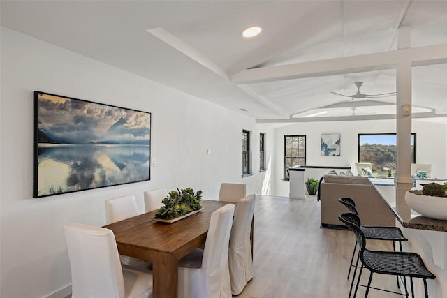 dining room with lofted ceiling, light wood-style floors, ceiling fan, and recessed lighting