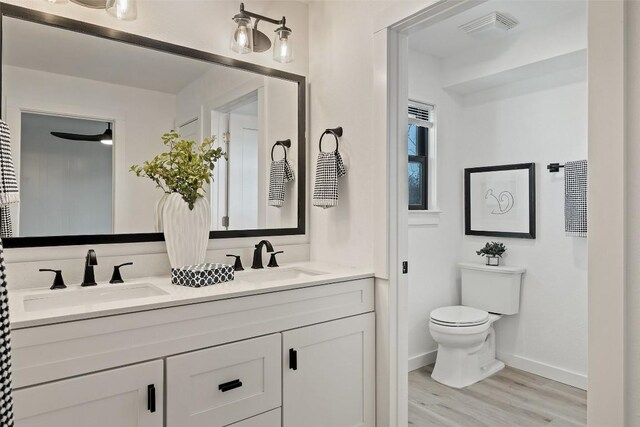 1201 Lake Shore Dr, Spicewood, TX 78669 - bathroom with double vanity and wood finished floors