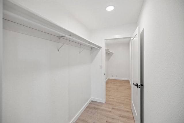 spacious closet with light wood-style floors