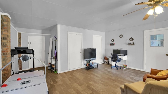 interior space with light wood-type flooring and a ceiling fan