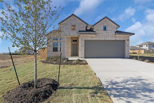 2705 Sage Ranch Dr Unit 6, Leander, TX 78641 - view of front facade featuring brick siding, concrete driveway, a front lawn, and an attached garage